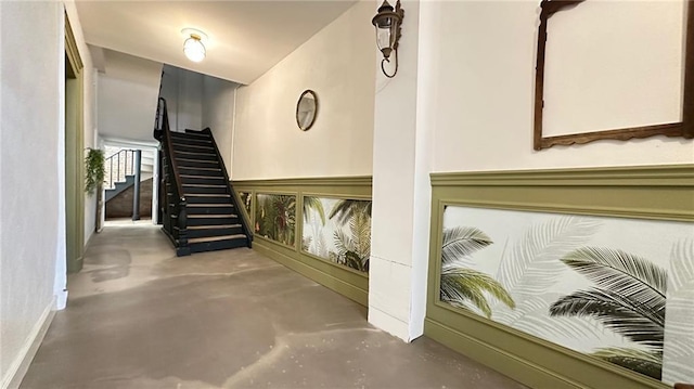 interior space featuring concrete flooring and baseboards