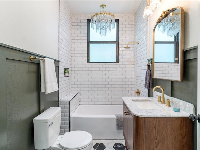 bathroom with toilet, vanity, bathtub / shower combination, and a chandelier