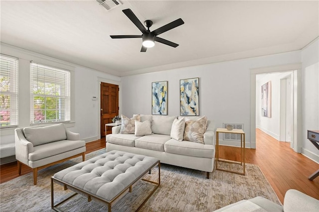 2108 Cherrydale Ave, Baton Rouge, LA 70808 - living room featuring baseboards, visible vents, a ceiling fan, and wood finished floors