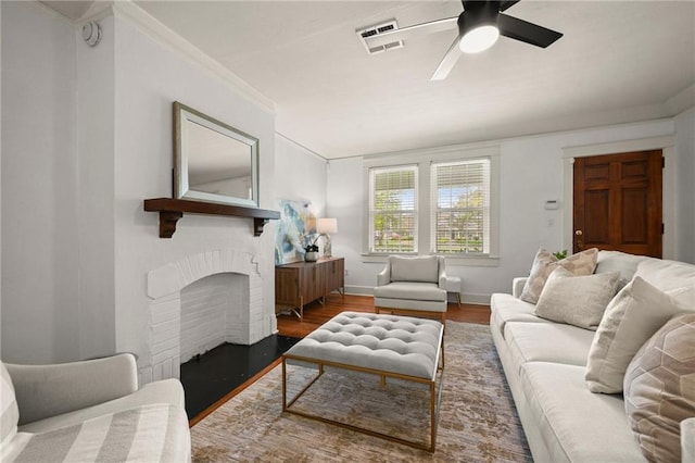 2108 Cherrydale Ave, Baton Rouge, LA 70808 - living area featuring crown molding, a fireplace, wood finished floors, baseboards, and ceiling fan