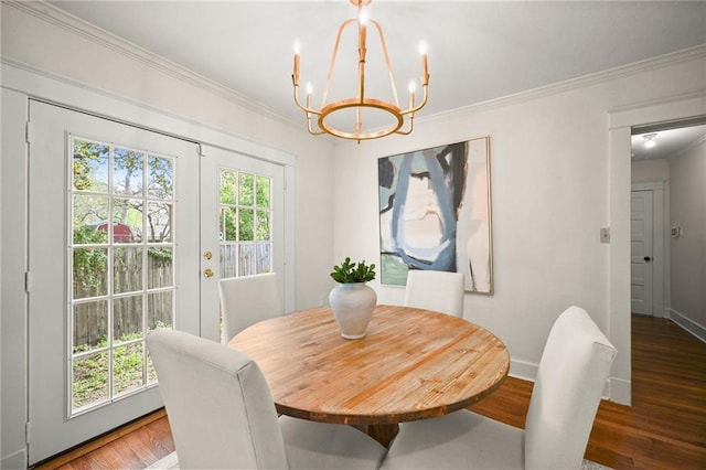 2108 Cherrydale Ave, Baton Rouge, LA 70808 - dining room with a notable chandelier, crown molding, wood finished floors, and a healthy amount of sunlight