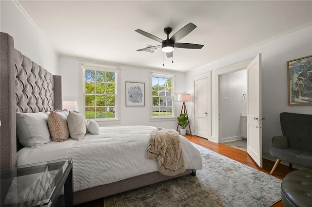 2108 Cherrydale Ave, Baton Rouge, LA 70808 - bedroom featuring baseboards, crown molding, wood finished floors, and a ceiling fan