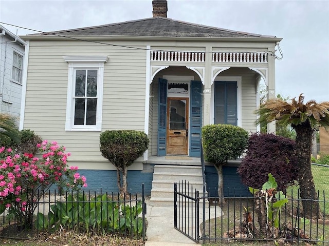 3321 Baronne St, New Orleans, LA 70113 - doorway to property with a chimney and fence