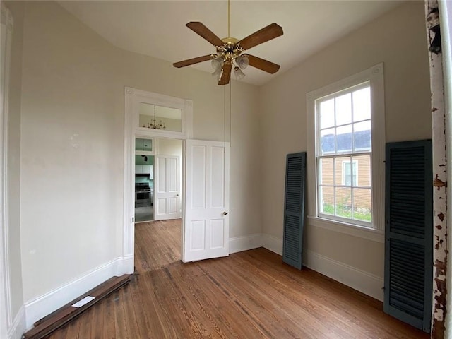 3321 Baronne St, New Orleans, LA 70113 - unfurnished bedroom featuring baseboards, ceiling fan, and wood finished floors