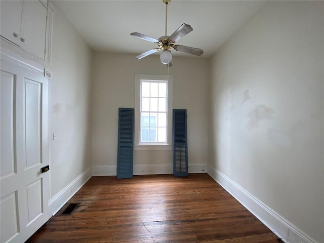 3321 Baronne St, New Orleans, LA 70113 - unfurnished room featuring dark wood finished floors, baseboards, visible vents, and ceiling fan