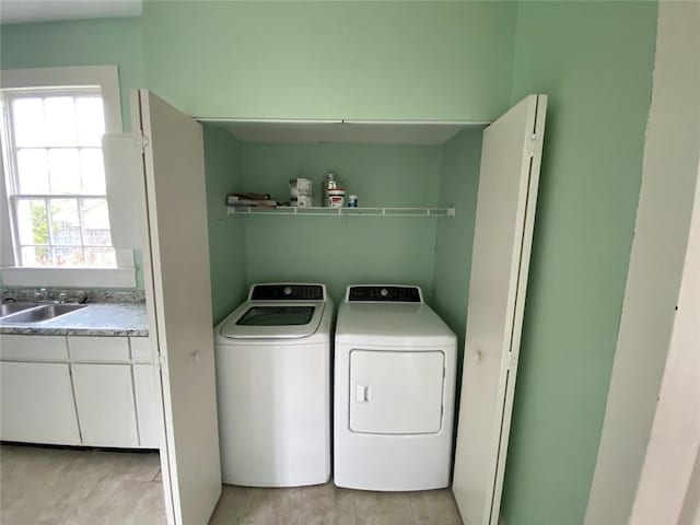 3321 Baronne St, New Orleans, LA 70113 - laundry room featuring washing machine and clothes dryer, laundry area, and a sink
