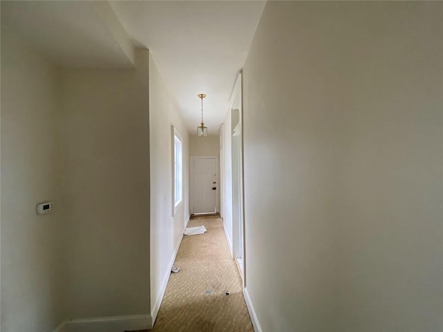3321 Baronne St, New Orleans, LA 70113 - hall with baseboards and light carpet