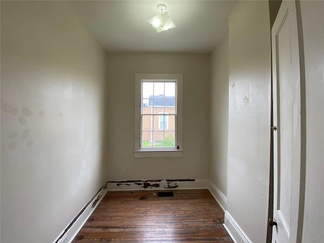 3321 Baronne St, New Orleans, LA 70113 - spare room featuring dark wood-style floors, baseboards, and visible vents