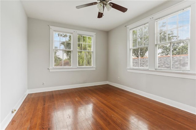 441921 Fontainebleau Dr, New Orleans, LA 70125 - empty room featuring hardwood / wood-style flooring, baseboards, ceiling fan, and a wealth of natural light