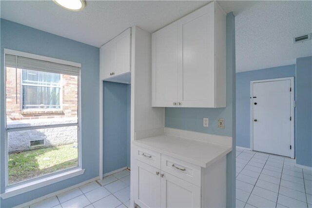 2260 Killington Dr, Harvey, LA 70058 - kitchen with white cabinetry, light countertops, plenty of natural light, and visible vents