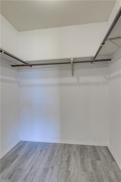 2260 Killington Dr, Harvey, LA 70058 - walk in closet with wood finished floors