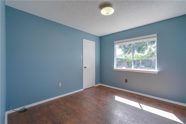 2260 Killington Dr, Harvey, LA 70058 - spare room with baseboards, a textured ceiling, and wood finished floors