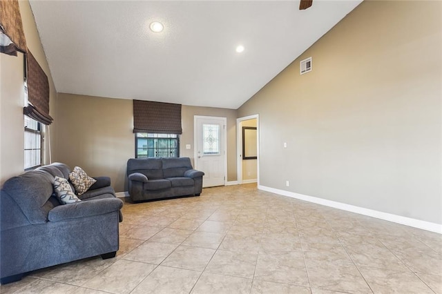 230 Evella Dr, Slidell, LA 70458 - living room with healthy amount of natural light, baseboards, light tile patterned floors, high vaulted ceiling, and recessed lighting