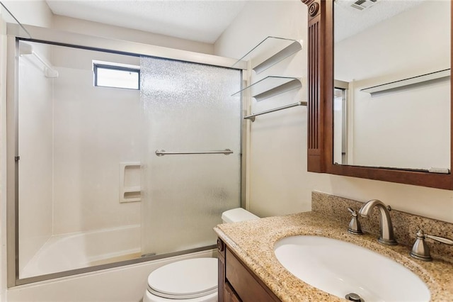 230 Evella Dr, Slidell, LA 70458 - bathroom featuring toilet, vanity, and bath / shower combo with glass door