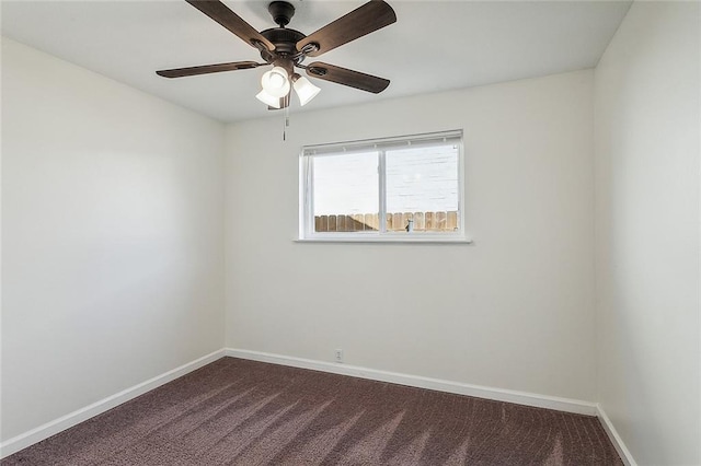 545 Brookmeade Dr, Gretna, LA 70056 - empty room featuring dark carpet, baseboards, and a ceiling fan