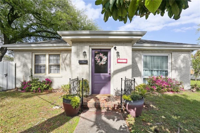 3701 Marigny St, New Orleans, LA 70122 - property entrance with a lawn and brick siding