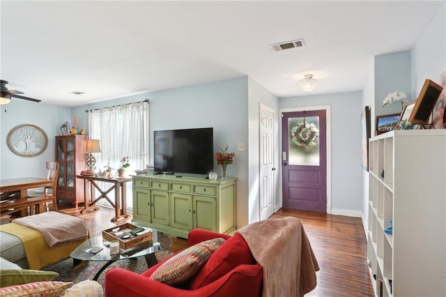 3701 Marigny St, New Orleans, LA 70122 - living area featuring baseboards, visible vents, wood finished floors, and a ceiling fan