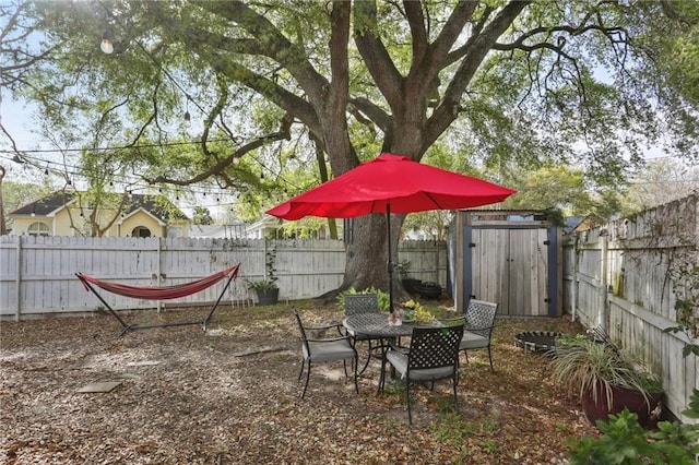 3701 Marigny St, New Orleans, LA 70122 - view of yard with a fenced backyard, a storage unit, and an outdoor structure