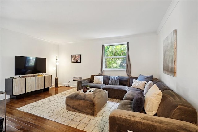 1430 Jackson Ave Unit 205, New Orleans, LA 70130 - living room featuring dark wood finished floors, crown molding, and baseboards