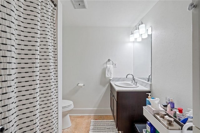 1430 Jackson Ave Unit 205, New Orleans, LA 70130 - full bath featuring toilet, tile patterned floors, vanity, a shower with curtain, and baseboards