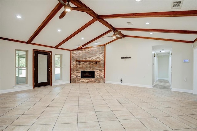 128 Belle Grove Dr, La Place, LA 70068 - unfurnished living room featuring light tile patterned floors, ceiling fan, visible vents, vaulted ceiling with beams, and a fireplace