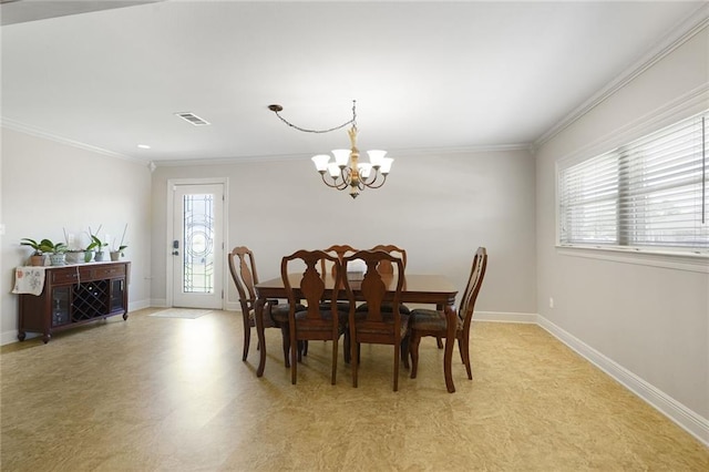dining room featuring baseboards, visible vents, ornamental molding, and an inviting chandelier