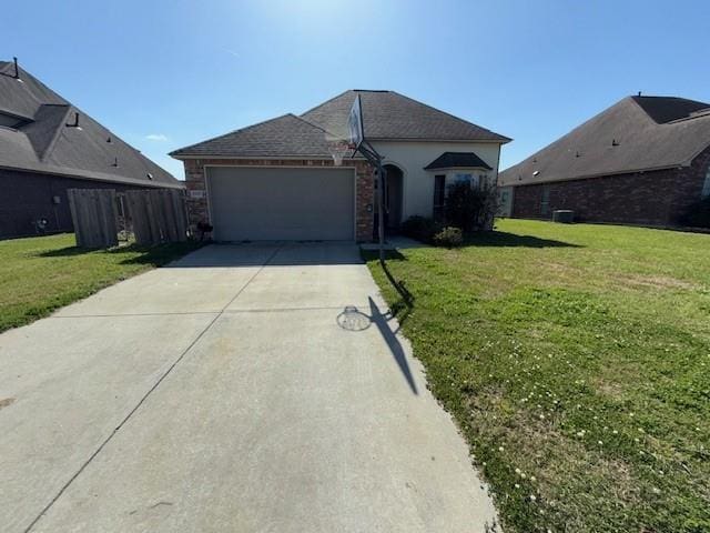 17657 Golden Eagle Dr, Prairieville, LA 70769 - view of front facade with a garage, concrete driveway, and a front yard