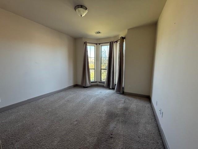 17657 Golden Eagle Dr, Prairieville, LA 70769 - unfurnished room with baseboards, visible vents, and light colored carpet