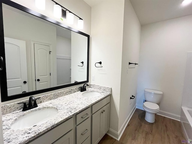 129 Olivia Dr, Luling, LA 70070 - full bathroom featuring wood finished floors, double vanity, and a bath