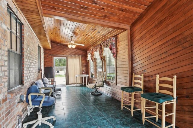 65398 Maple St, Mandeville, LA 70448 - living area featuring wooden walls, a ceiling fan, and wood ceiling