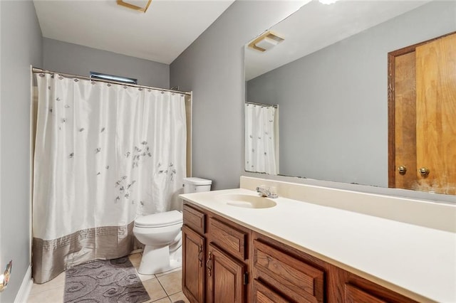 65398 Maple St, Mandeville, LA 70448 - full bath featuring toilet, vanity, tile patterned flooring, and a shower with curtain