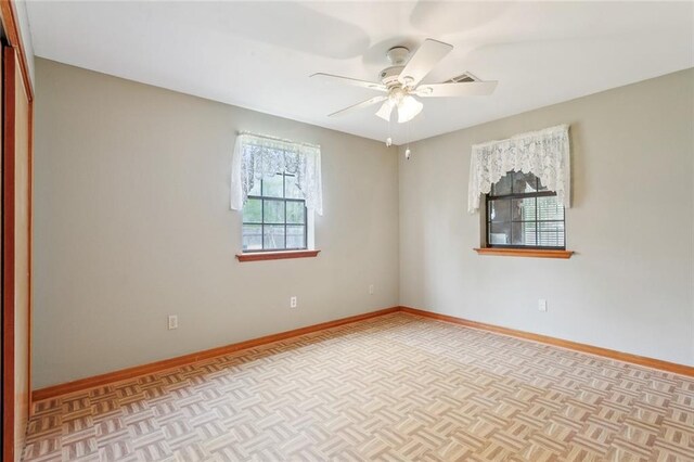 65398 Maple St, Mandeville, LA 70448 - spare room featuring baseboards and ceiling fan