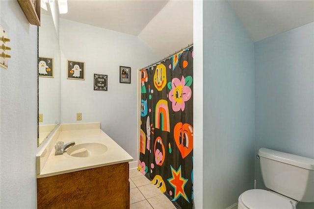 65398 Maple St, Mandeville, LA 70448 - full bathroom featuring tile patterned flooring, toilet, vanity, vaulted ceiling, and a shower with shower curtain