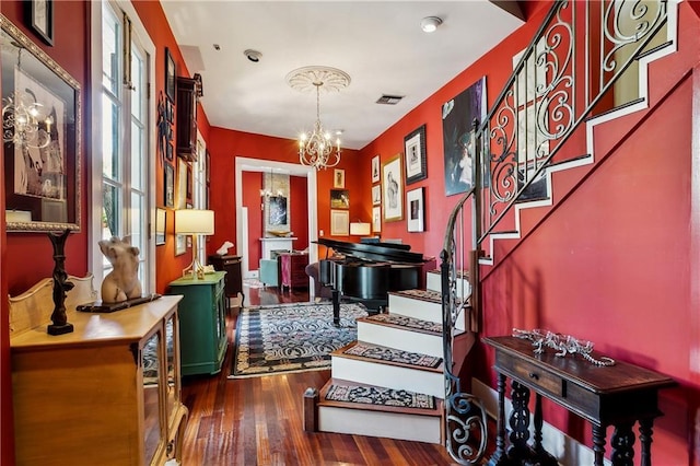 3342 Bell St, New Orleans, LA 70119 - interior space featuring stairs, wood finished floors, and a chandelier