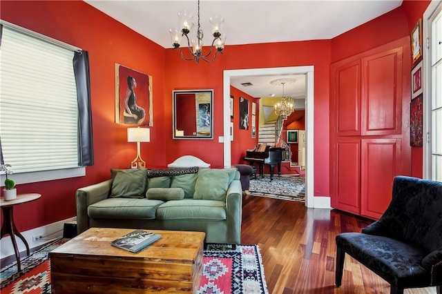 3342 Bell St, New Orleans, LA 70119 - living area with dark wood-style flooring, baseboards, and a chandelier