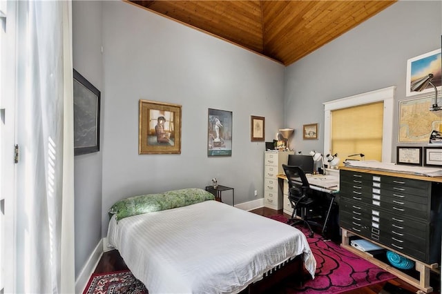 3342 Bell St, New Orleans, LA 70119 - bedroom featuring baseboards, lofted ceiling, and wood finished floors