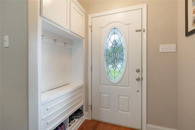 mudroom with baseboards and dark wood-style floors
