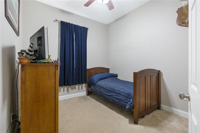 bedroom featuring carpet flooring, baseboards, and a ceiling fan