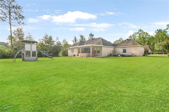 view of yard with a playground