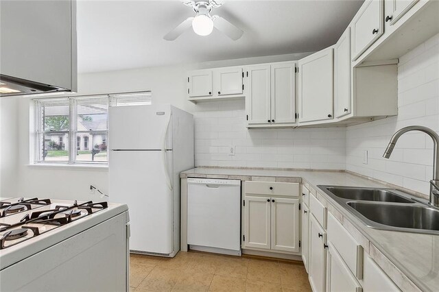 3013 Volpe Dr, Chalmette, LA 70043 - kitchen with light countertops, a sink, white appliances, and tasteful backsplash