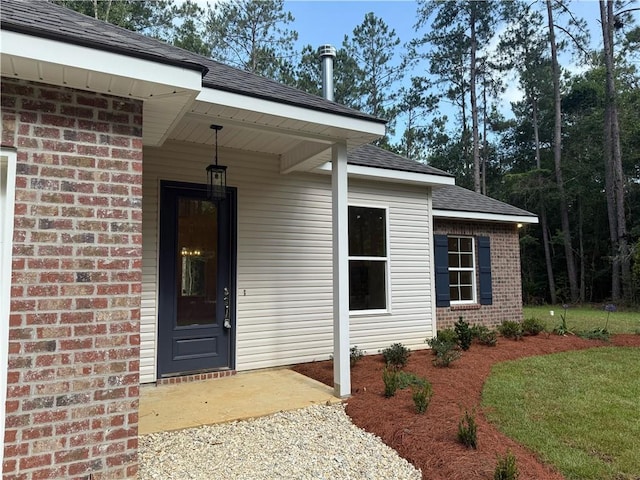 75396 Henderson Rd, Covington, LA 70435 - entrance to property with brick siding and a shingled roof