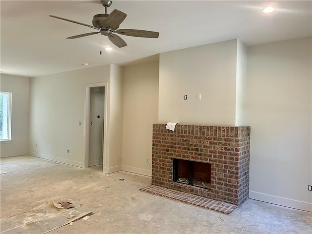 75396 Henderson Rd, Covington, LA 70435 - unfurnished living room with a fireplace, ceiling fan, and baseboards