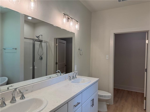 75396 Henderson Rd, Covington, LA 70435 - full bath with a stall shower, wood finished floors, and double vanity