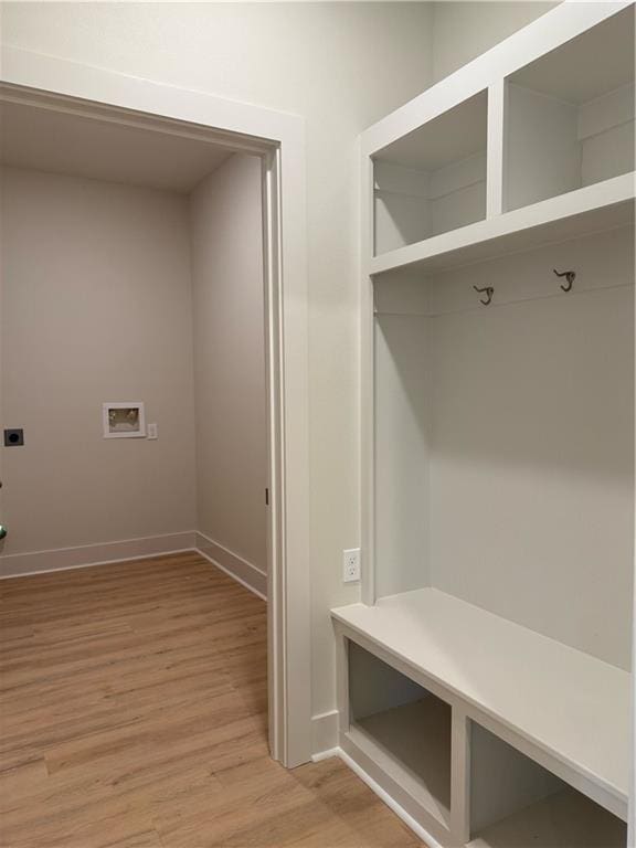 75396 Henderson Rd, Covington, LA 70435 - mudroom featuring light wood-style flooring and baseboards