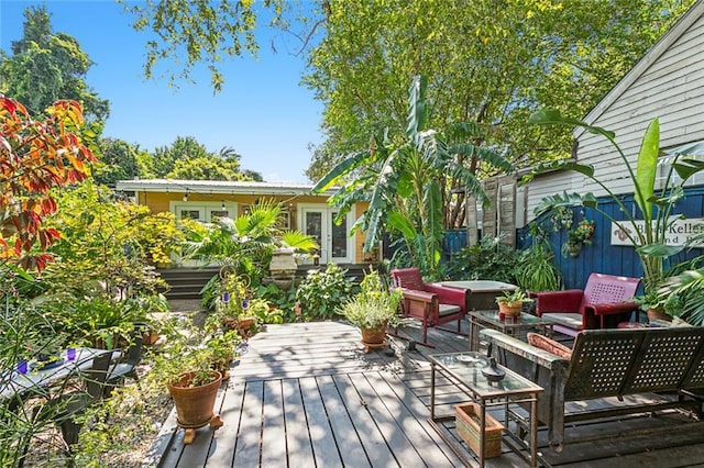 1838 Burgundy St, New Orleans, LA 70116 - wooden deck featuring a jacuzzi and french doors
