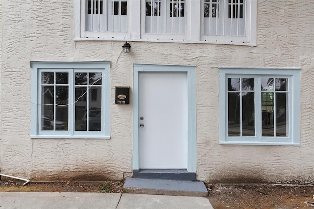 4237 Fontainebleau Dr, New Orleans, LA 70125 - property entrance with stucco siding