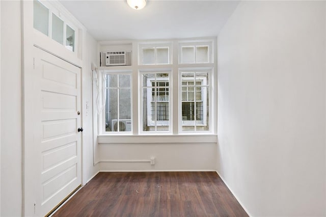 4237 Fontainebleau Dr, New Orleans, LA 70125 - foyer with dark wood-type flooring, healthy amount of natural light, and a wall mounted air conditioner