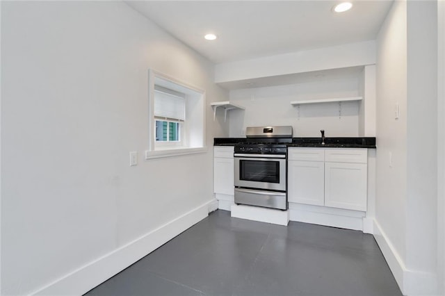 4237 Fontainebleau Dr, New Orleans, LA 70125 - kitchen featuring stainless steel gas stove, open shelves, white cabinetry, recessed lighting, and finished concrete floors