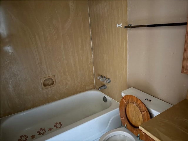 bathroom with toilet and shower / bathing tub combination