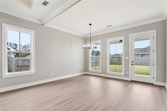 unfurnished room featuring wood finished floors, baseboards, and visible vents